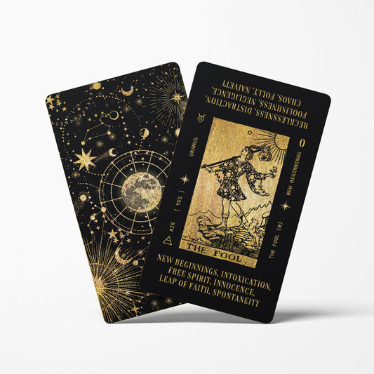 black and gold tarot cards with tarot card meanings printed on them