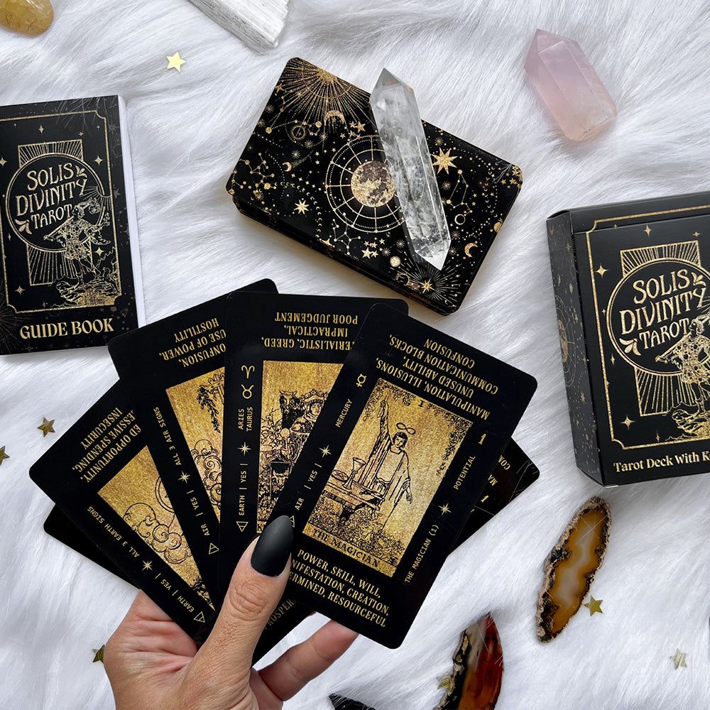 black and gold tarot card deck with tarot card meanings